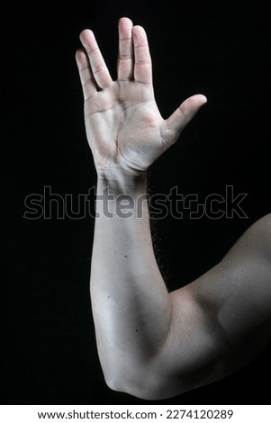 Similar – Close up front portrait of one young middle age athletic woman in sportswear in gym over dark background, standing in boxing stance with hands and fists, looking at camera