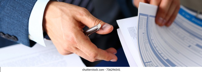 Male Arm In Suit Offer Insurance Form Clipped To Pad And Silver Pen To Sign Closeup. Strike A Bargain, Driver Money Loss Prevention, Secure Road Trip, Harmless Drive Idea, Owner Protective Concept