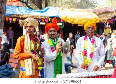 Male Artists Playing Regional Folk Music With Ethnic White Dress And Colorful Turban At Surajkund Craft Fair, Faridabad, Haryana, India, February 2020