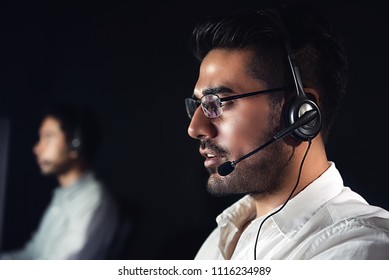 Male Asian Customer Care Operators Working Night Shift In Call Center