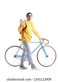 Male Asian Student With Bicycle Waving Hand On White Background