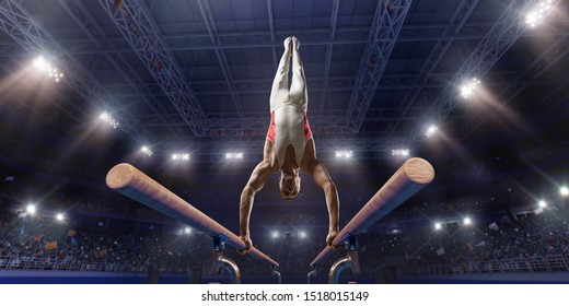 Male athlete doing a complicated exciting trick on parallel bars in a professional gym. Man perform stunt in bright sports clothes - Powered by Shutterstock