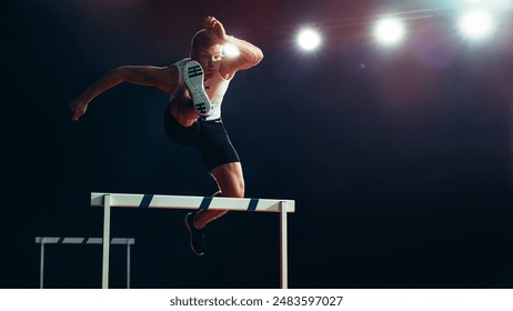 Male Athlete in Mid-air, Leaping Over Hurdle Under Bright Stadium Lights. Agility, Strength, and Determination in High-energy Track and Field Championship Event. - Powered by Shutterstock