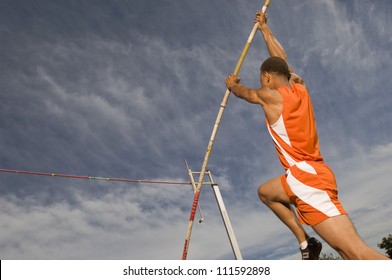 Male Athlete Performing A Pole Vault