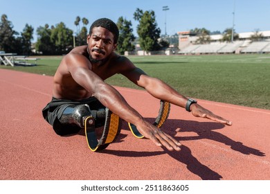 Male athlete with prosthetic legs crunching - Powered by Shutterstock