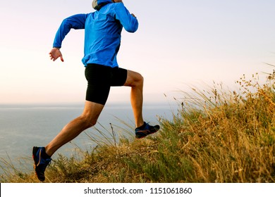 male athlete runner run up mountain on trail 
