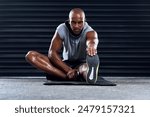 Male athlete, stretching and leg in portrait, exercise for sports in workout, fitness at gym. Healthy, African man and challenge in cool down routine for wellness, muscle for strength training