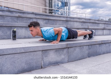 Male Athlete, Tanned Man, Summer City, Push-ups, Lying On Bench, Chest Training, Bar On Press, Bottle Of Protein With Water, Fitness Workout, Background Concrete Steps. Free Space For Motivation Text