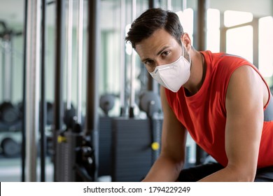 Male Athlete Wearing Protective Face Mask In Health Club And Looking At Camera. 