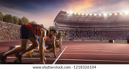 Male athletes sprinting. Three men in sport clothes on starting line prepares to run at the running track in professional stadium