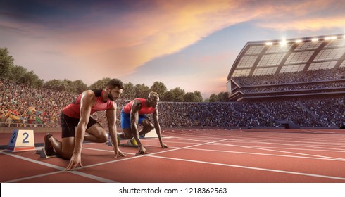 Male athletes sprinting. Two men in sport clothes on starting line prepares to run at the running track in professional stadium - Powered by Shutterstock