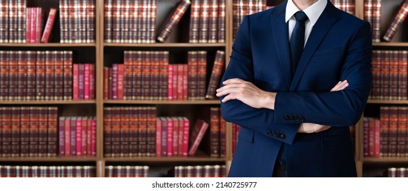 Male Attorney With Arms Crossed. Lawyer In Office - Powered by Shutterstock