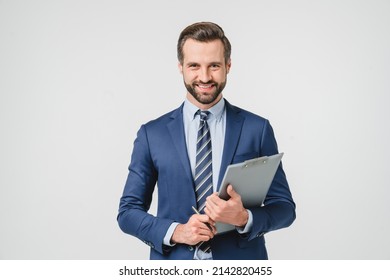 Male auditor inspector examiner controller businessman writing on clipboard, checking the quality of goods and service looking at camera isolated in white background