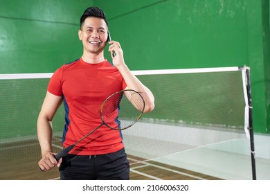 Male Badminton Player In Red Making A Call