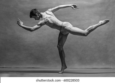 The male ballet dancer posing over gray background - Powered by Shutterstock