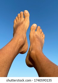 Male Bare Feet  Against Blue Background