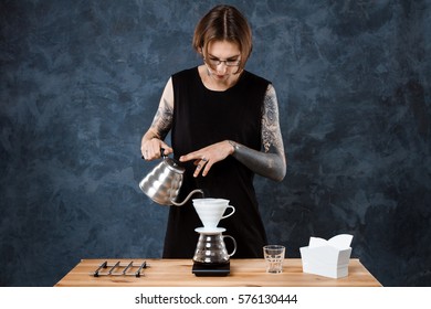 Male Barista Brewing Coffee. Alternative Method Pour Over.