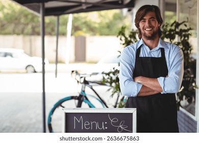 Male barista standing under awning at cafe with chalkboard menu, bicycle, potted plants, copy space. Street scene, urban lifestyle, hospitality, casual attire, outdoor ambiance, greenery, vibrant - Powered by Shutterstock - Get 15% off with code: PIKWIZARD15