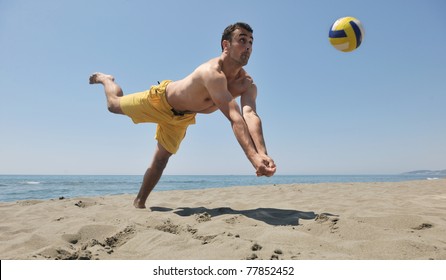 Male Beach Volleyball Game Player Jump On Hot Sand