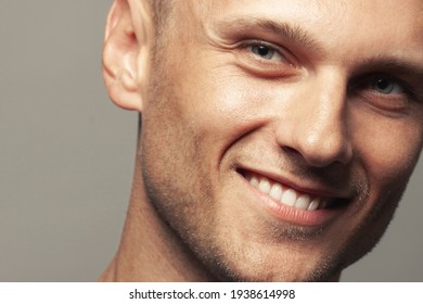 Male beauty concept. Portrait of handsome 30-year-old man with blue eyes posing over gray background. Close up. Classic style. Shiny white smile. Headshot. Studio shot - Powered by Shutterstock