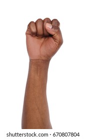 Male black fist isolated on white background. African american clenched hand, gesturing up. Counting, aggression, brave, masculinity concept - Shutterstock ID 670807804