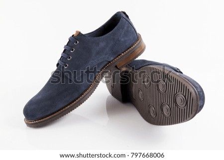 Male blue elegant shoes on white background, isolated product, comfortable footwear.