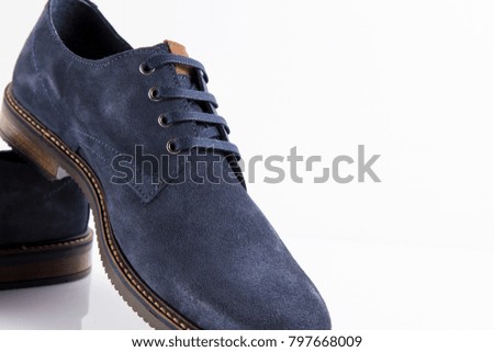 Male blue elegant shoes on white background, isolated product, comfortable footwear.