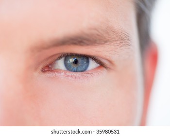 Male blue eye in close-up as symbol concept of successful business vision