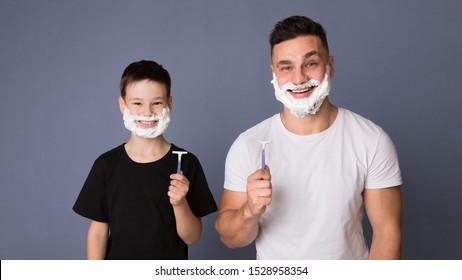 Male Body Care. Dad Teaching His Teen Son How Shave, Standing With Razors And Shaving Foam, Grey Panorama Background