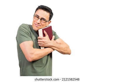 Male bookworm in glasses hugging favorite book