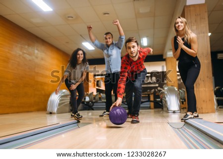 Male bowler throws ball, throwing in action