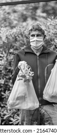 Male Bringing Groceries At Home In Covid Pandemic .