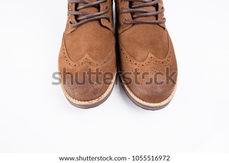 Male brown leather boot on white background, isolated product, comfortable footwear.
