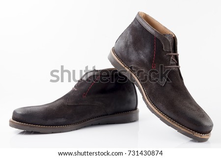 Male brown leather boot on white background, isolated product.