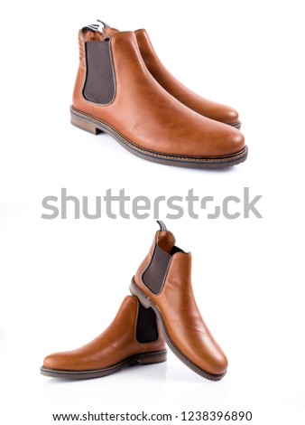 Male brown leather boots on white background, isolated product, comfortable footwear.