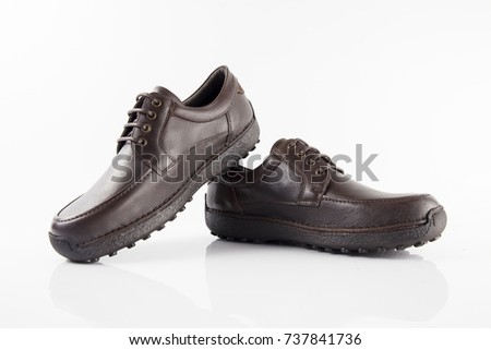 Male brown leather shoe on white background, isolated product.