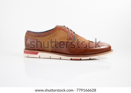 Male brown and red leather elegant shoe on white background, isolated product, comfortable footwear.