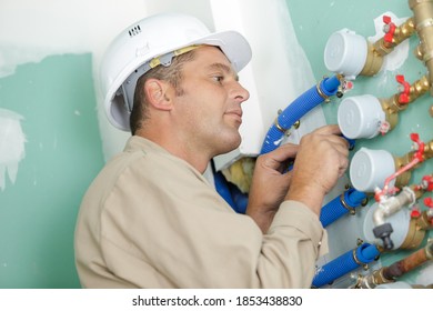 A Male Builder Checking Water Meter