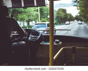 Male Bus Driver In The City Back View