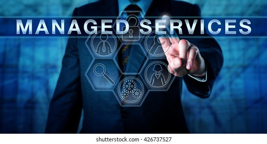 Male business consultant is touching MANAGED SERVICES an a virtual interactive control interface. Information technology concept and business metaphor for outsourcing management responsibility.