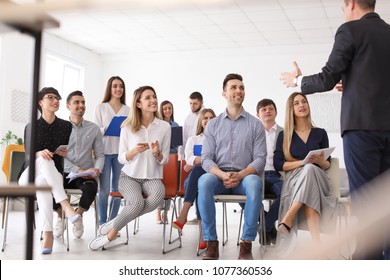 Male Business Trainer Giving Lecture In Office