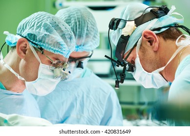 Male Cardiac Surgeon At Child Cardiosurgery Operating Room