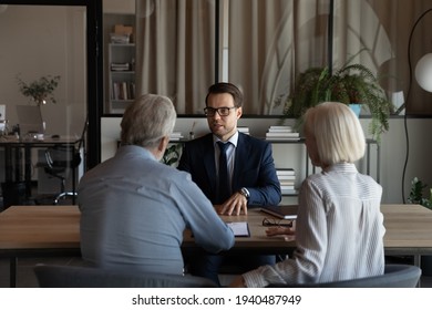 Male Caucasian specialist have meeting with mature couple clients, discuss health insurance for older people. Middle-aged spouses customers consult with relator or broker. Realty, rent concept.