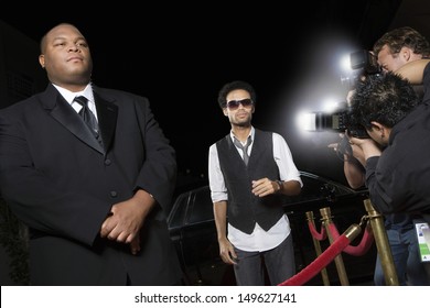 Male Celebrity Being Photographed At Media Event