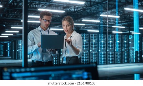 Male CEO Discusses Problem Solving with Female Partner in Office, They Brainstorming while Look on a Laptop. Smart Businesspeople Working in Finance. Specialists Work in Team Concept - Shutterstock ID 2136788105
