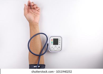 Male Checking Blood Pressure On White Background