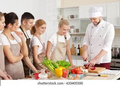 Male Chef And Group Of People At Cooking Classes