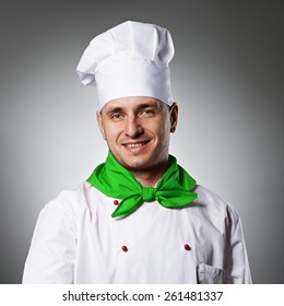 Male Chef With Thumb Up Portrait Against Grey Background