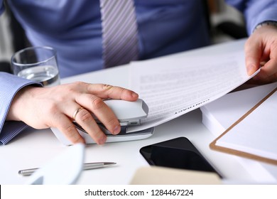 Male Clerk Arm Pin Together Some Papers With Stapler Closeup. Handy Payroll Fastener Bookkeeper Sheet Organization Concept