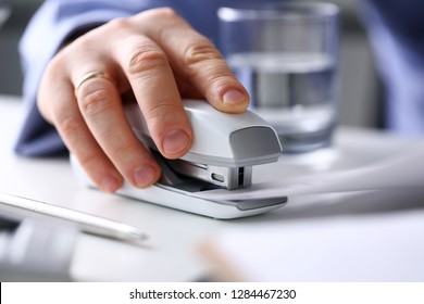 Male Clerk Arm Pin Together Some Papers With Stapler Closeup. Handy Payroll Fastener Bookkeeper Sheet Organization Concept